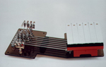 The internal working parts of the guitar showing its mechanical precision
